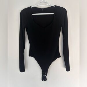 Dynamite black long sleeve body suit.